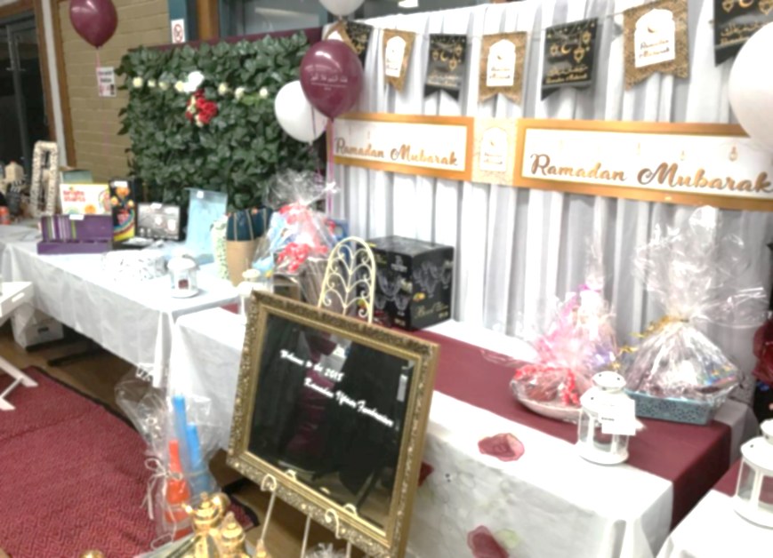 Decorated tables and Ramadan Mubarak banners at the association's annual Ramadan fundraiser iftar